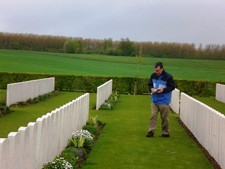 Ken Goodchild visits the grave of Sydney Sheen in Tincourt New British Cemetery